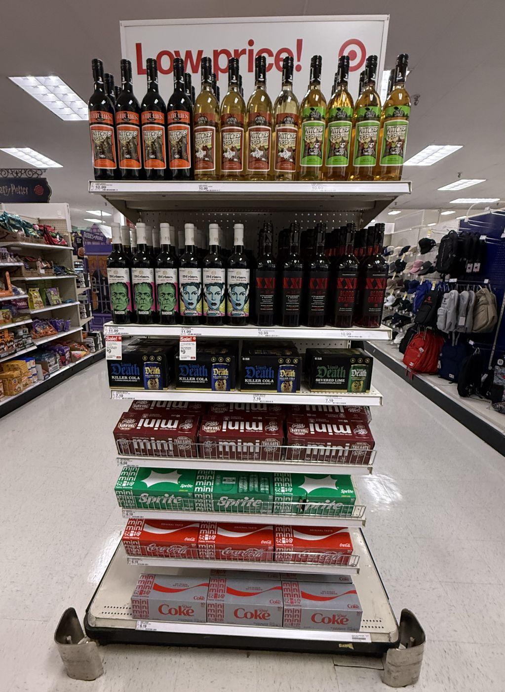 Target Low price endcap with Halloween wines, Liquid Death and Coca-Cola mini cans