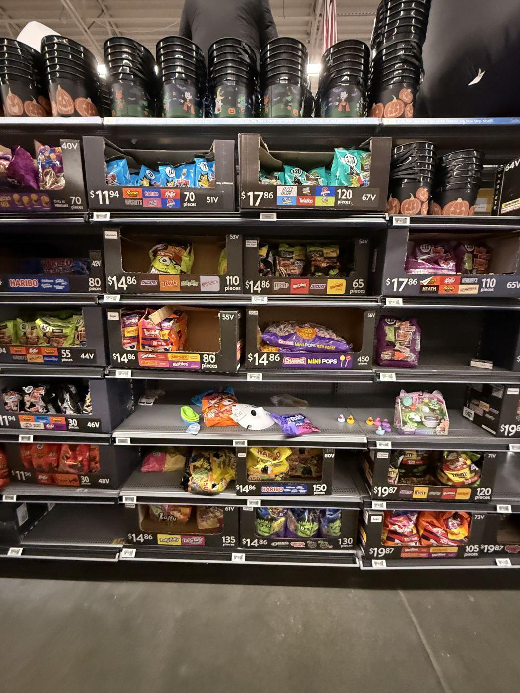 Walmart variety-bag aisle with prices climbing from $11.94 to $19.87 by piece count